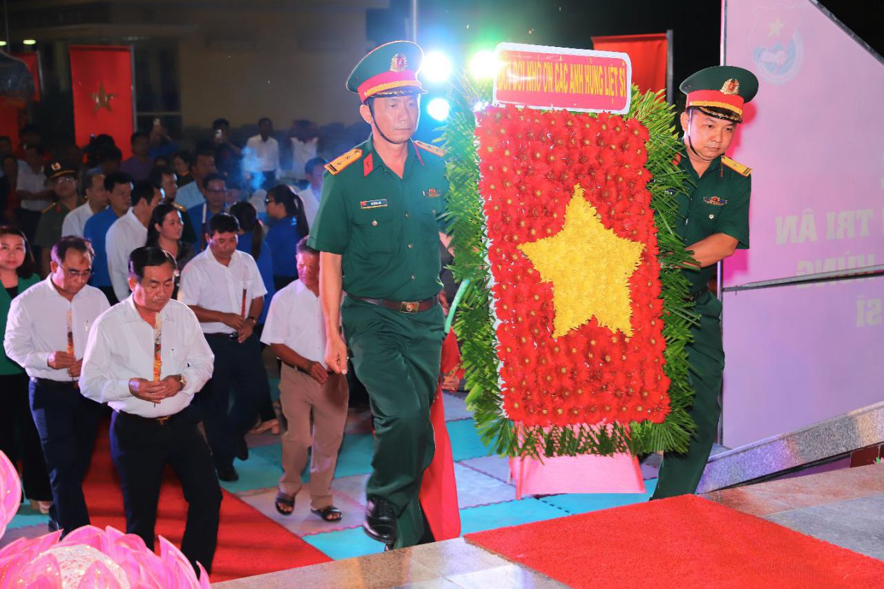 A group of men in uniform walking on a stage Description automatically generated