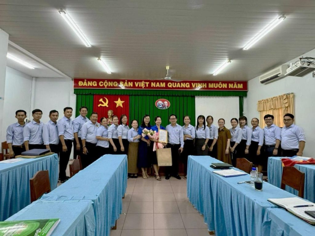 A group of people standing in a room